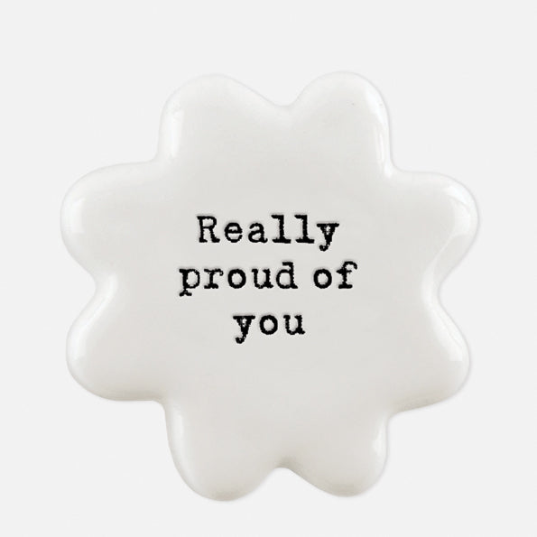East Of India white porcelain token with black wording 'Really Proud Of You'