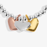 Silver bracelet with rose, gold and silver heart charms