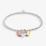 Silver bracelet with rose, gold and silver heart charms
