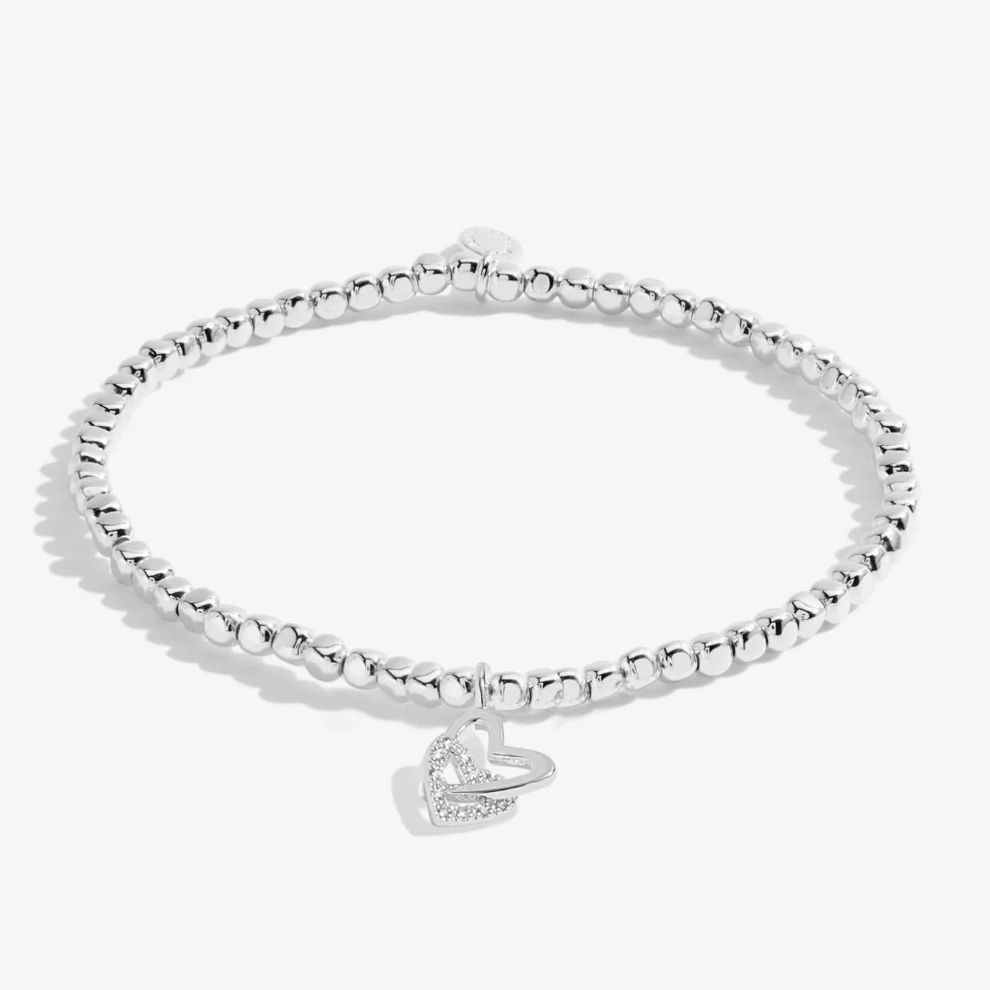 Silver bracelet with two hearts linked