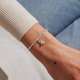 Silver bracelet with two hearts linked