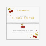 Joma jewellery stretch beaded silver plated bracelet with red cherry charm presented on a sentiment card.