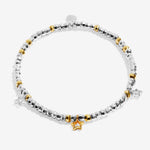 Joma beaded bracelet with trio charm design