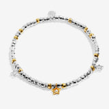 Joma beaded bracelet with trio charm design