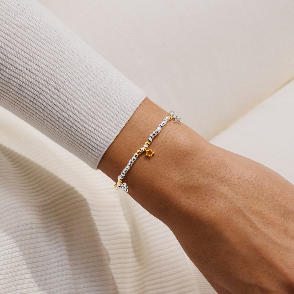 Joma beaded bracelet with trio charm design