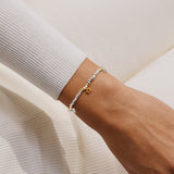 Joma beaded bracelet with trio charm design