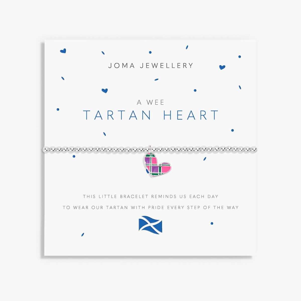 A Joma Jewellery 'A Wee Tartan Heart' bracelet on a white display card. The bracelet features a silver-toned chain and a small heart charm decorated with a pink, green, and purple tartan pattern.