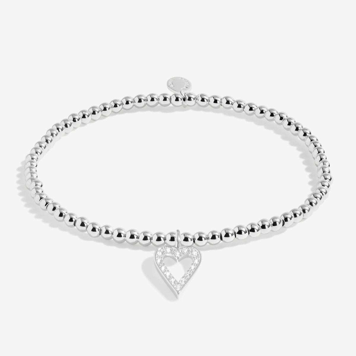 Joma jewellery silver plated beaded stretch bracelet with hanging heart sparkling charm presented on sentiment card.