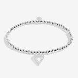 Joma jewellery silver plated beaded stretch bracelet with hanging heart sparkling charm presented on sentiment card.