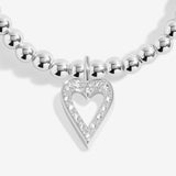 Joma jewellery silver plated beaded stretch bracelet with hanging heart sparkling charm presented on sentiment card.