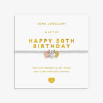 A silver bracelet with small heart-shaped charms featuring rose gold, silver and gold details, displayed on a white Joma Jewellery gift card that reads 'A LITTLE HAPPY 50TH BIRTHDAY'.