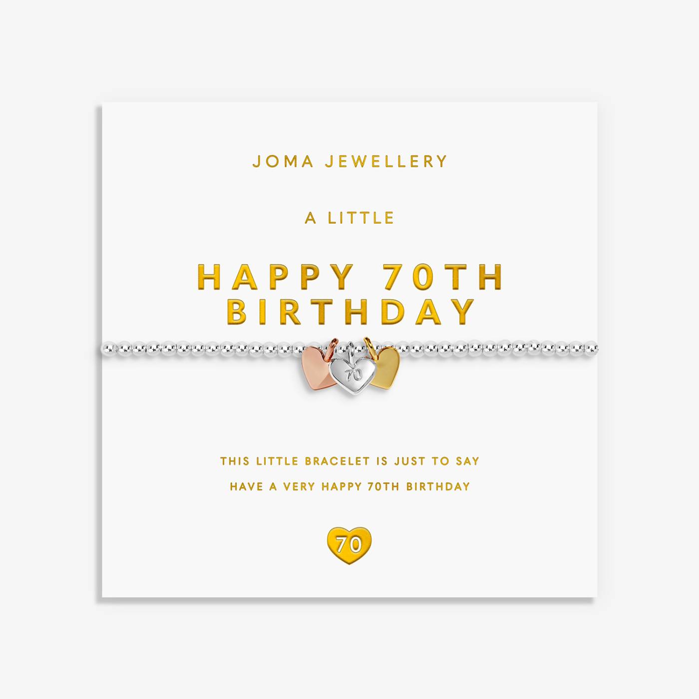 A silver 70th birthday bracelet by Joma Jewellery, featuring 3 heart charms in silver, gold and rose gold displayed on its white gift card with gold lettering.