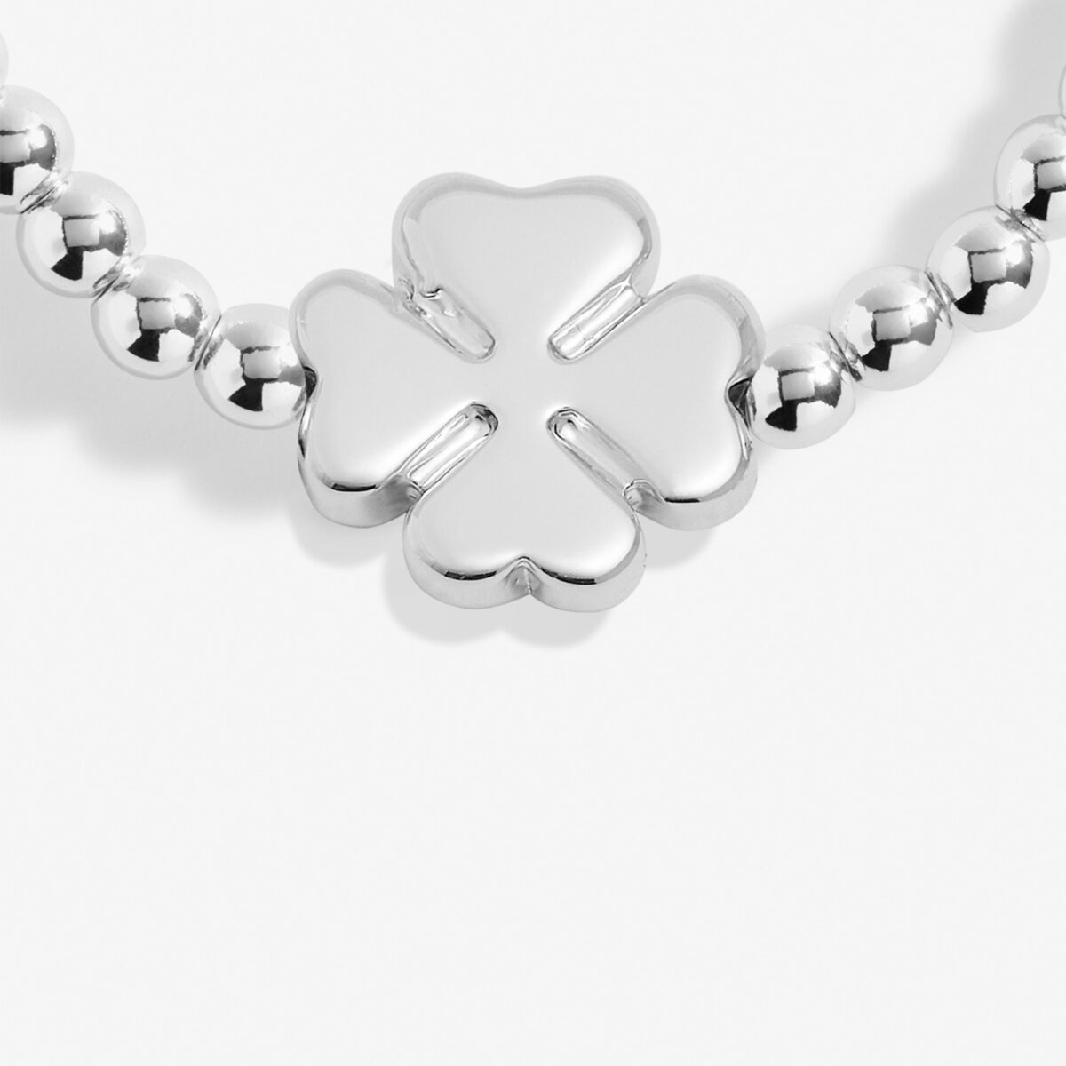 Joma Jewellery silver plated beaded bracelet with four leaf clover charm presented on a foil stamped sentiment card.