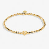Joma Jewellery gold plated stretch beaded bracelet with heart charm and presented on a foil stamped sentiment card.