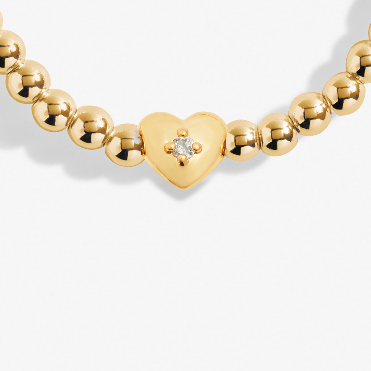 Joma Jewellery gold plated stretch beaded bracelet with heart charm and presented on a foil stamped sentiment card.