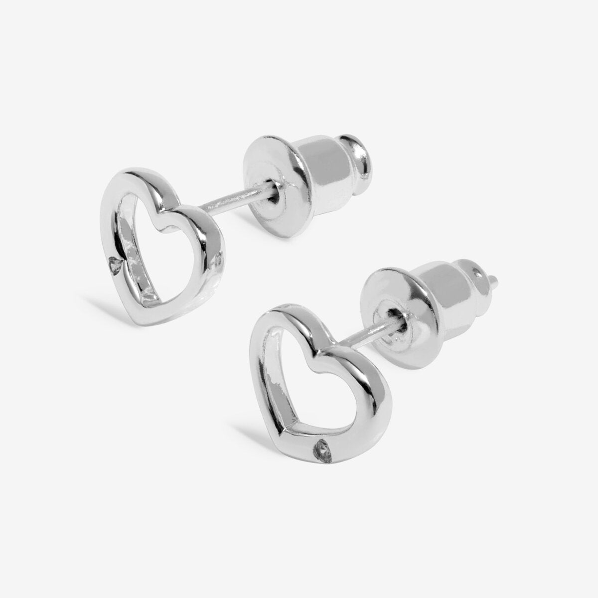 Silver heart-shaped stud earrings on a white background