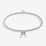 Joma Jewellery beaded stretch bracelet with hanging charm featuring 2 champagne glasses with red sparkle detail.