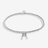 Joma Jewellery beaded stretch bracelet with hanging charm featuring 2 champagne glasses with red sparkle detail.