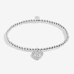 Joma Jewellery stretch beaded bracelet with hanging heart sparkly charm presented on a foil stamped sentiment card.