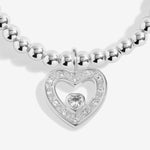 Joma Jewellery stretch beaded bracelet with hanging heart sparkly charm presented on a foil stamped sentiment card.