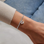 Joma Jewellery stretch beaded bracelet with hanging heart sparkly charm presented on a foil stamped sentiment card.