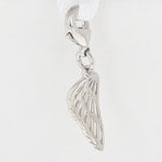 A silver angel wing charm with a detailed cutout design, hanging from a white ribbon clasp against a plain white background.