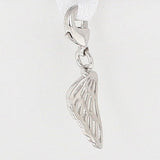 A silver angel wing charm with a detailed cutout design, hanging from a white ribbon clasp against a plain white background.