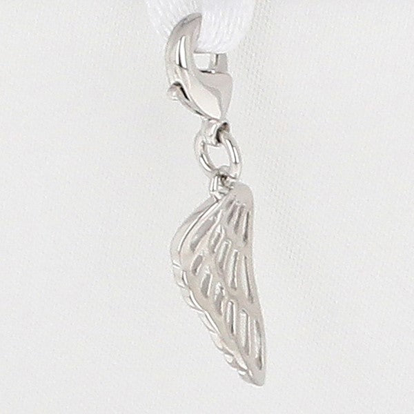 A silver angel wing charm with a detailed cutout design, hanging from a white ribbon clasp against a plain white background.