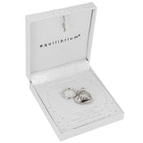 A silver angel keychain displayed inside an open white gift box with the brand name 'equilibrium' printed inside the lid.