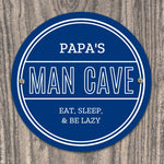 Personalised blue circular Pap's Man Cave sign with white lettering.