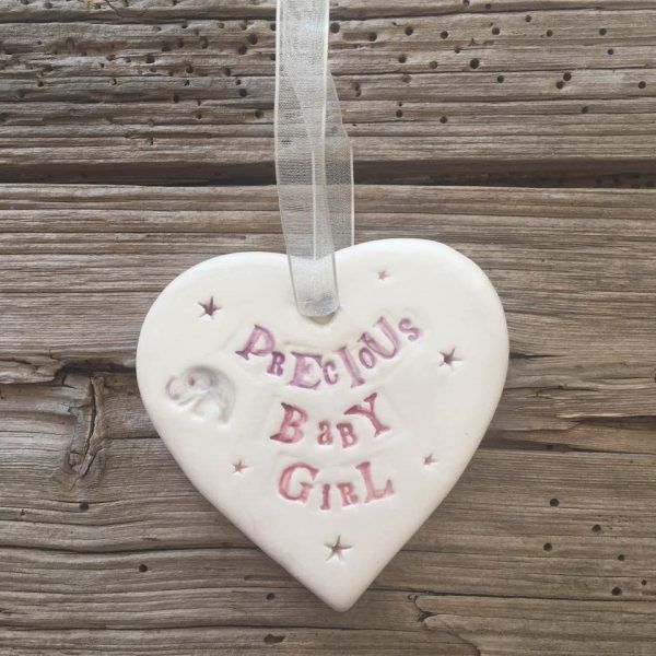 Hand painted ceramic heart featuring elephant and star design and the sentiment 'Precious Baby Girl'  Handmade in the UK using clay, glaze and paint sourced locally.