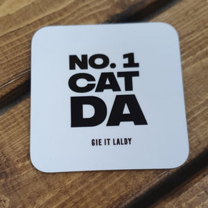 Monochrome Coaster featuring the Scottish slang slogan:  'No.1 Cat Da  '  Printed in Glasgow.    Material:  Gloss coaster  Dimensions: 9cm x 9cm  Colour - White background with black font