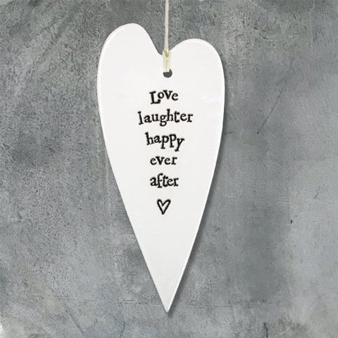White Hanging Long Porcelain Heart from East of India which reads:  'Love laughter happy ever after'