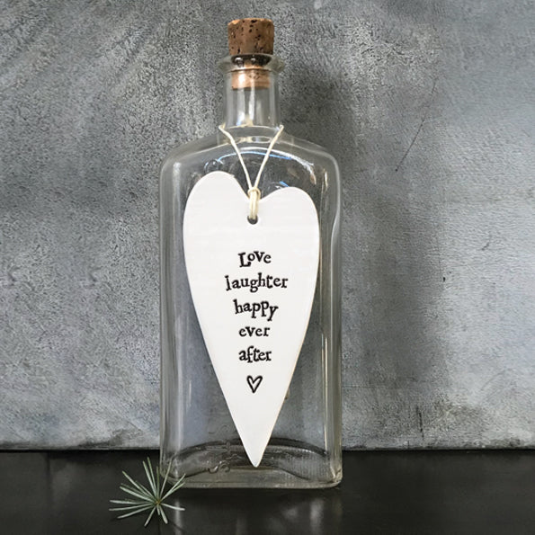White Hanging Long Porcelain Heart from East of India which reads:  'Love laughter happy ever after'