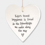 East of India hanging porcelain heart which reads:  'Life's truest happiness is found in the friendships we make along the way'