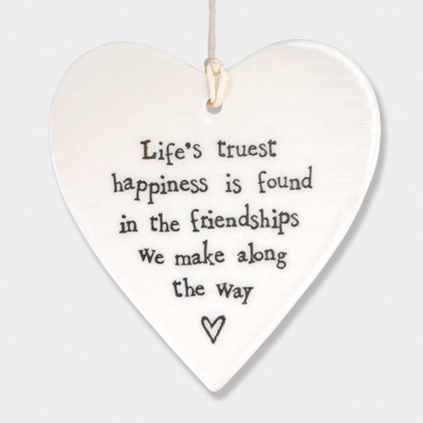 East of India hanging porcelain heart which reads:  'Life's truest happiness is found in the friendships we make along the way'