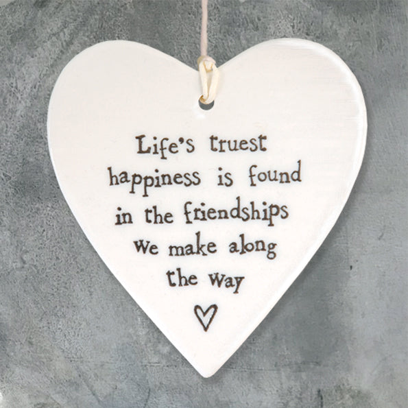 East of India hanging porcelain heart which reads:  'Life's truest happiness is found in the friendships we make along the way'