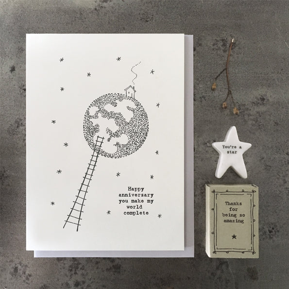  ***Price Includes Delivery ***   This East of India out of this world anniversary card features the greeting:  'Happy anniversary you make my world complete.'  With a pretty world illustration and blank inside for your own message.