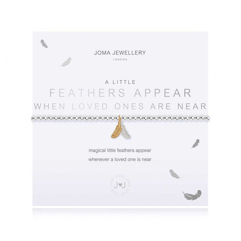 Joma Jewellery 'a little' bracelet with pretty silver and gold feather charms, presented on a sentiment card which reads:  'magical little feathers appear whenever a loved one is near'
