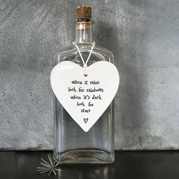East of India hanging porcelain heart which reads:  'When it rains look for rainbows, when it's dark look for stars'
