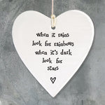 East of India hanging porcelain heart which reads:  'When it rains look for rainbows, when it's dark look for stars'