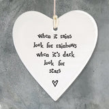East of India hanging porcelain heart which reads:  'When it rains look for rainbows, when it's dark look for stars'