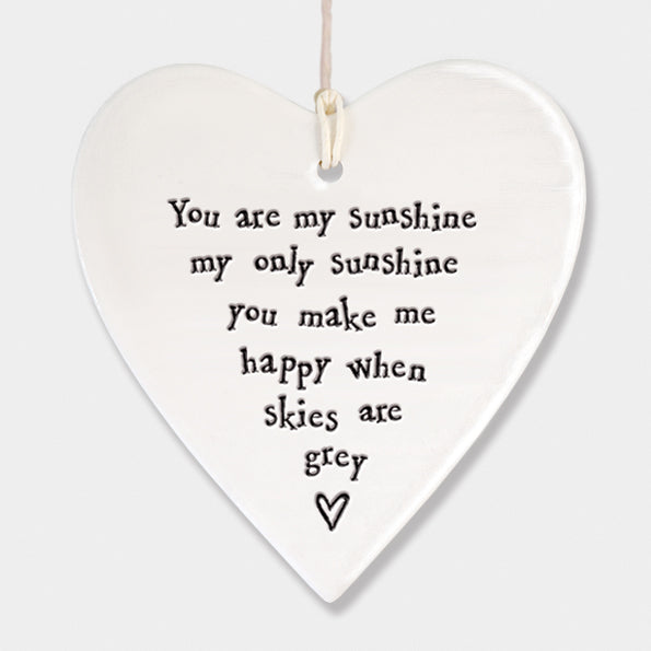 White Hanging Porcelain Heart from East of India which reads:  'You are my sunshine, my only sunshine, you make me happy when skies are grey'