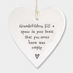 East of India hanging porcelain heart which reads:  'Grandchildren fill a space in your heart that you never knew was empty'