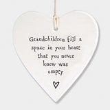 East of India hanging porcelain heart which reads:  'Grandchildren fill a space in your heart that you never knew was empty'