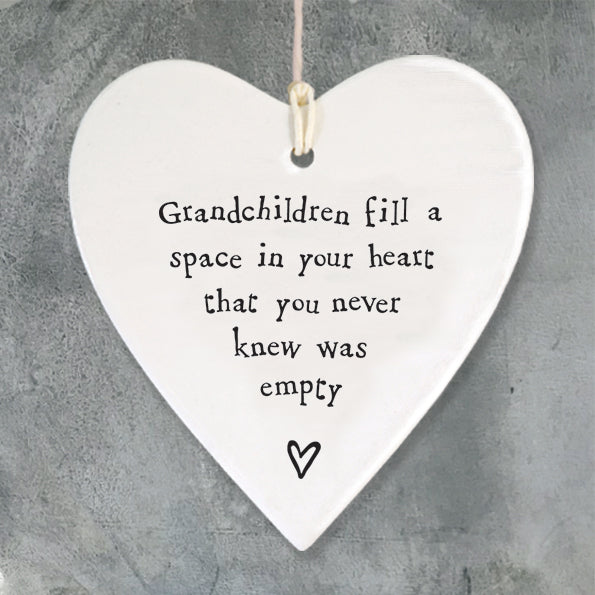 East of India hanging porcelain heart which reads:  'Grandchildren fill a space in your heart that you never knew was empty'