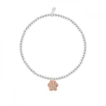 This cute silver plated stretch bracelet from Joma Jewellery's 'a little' pet range features an adorable little rose gold dog paw charm and comes presented on a sentiment card which reads:  'A Little'  'Love has four paws'  'this pretty charm is all yours, a reminder that love has four paws'