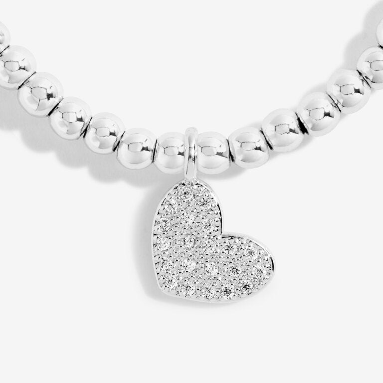 Joma Jewellery 'a little' bracelet with pretty little charm, presented on a sentiment card which reads:  'Wear this little bracelet for all to see, it's your eighteenth birthday – time to party'  Beautifully packaged in it's own Joma Jewellery envelope and gifting card.