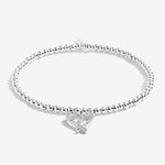 Joma Jewellery 'a little' bracelet with pretty little charm, presented on a sentiment card which reads:  'This bracelet is to celebrate turning twenty-one, hip hip hooray – the fun has just begun!'  Beautifully packaged in it's own Joma Jewellery envelope and gifting card.