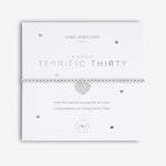 Joma Jewellery 'a little' bracelet with pretty little charm, presented on a sentiment card which reads:  'Wear this little bracelet for all to see, congratulations on turning terrific thirty!'  Beautifully packaged in it's own Joma Jewellery envelope and gifting card.